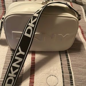 Dkny bag with strap. Never carried. Brand new with tag.
